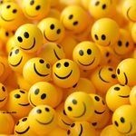 Photo: A pile of yellow spheres with smiley faces on them